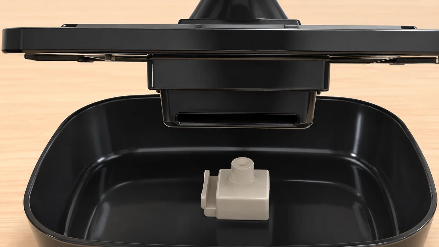 Illustrated underside of a raised Fountelio tray above the reservoir pump module