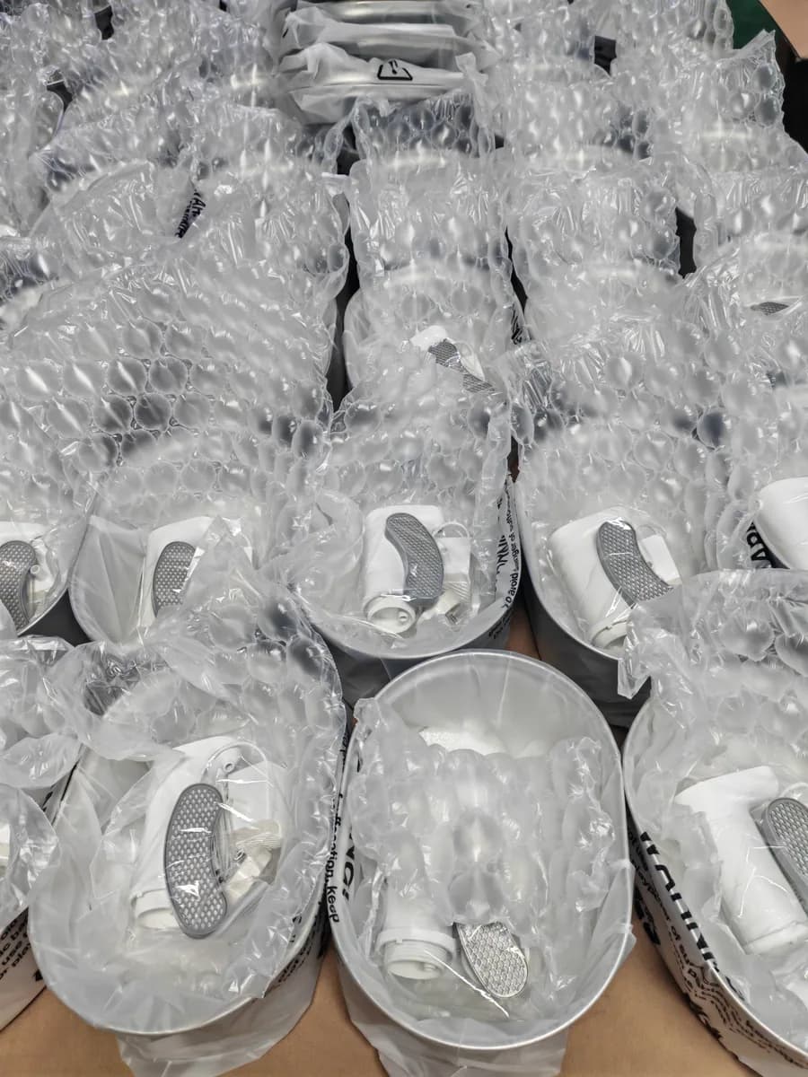 Individual stainless steel fountain trays in protective bubble wrapping