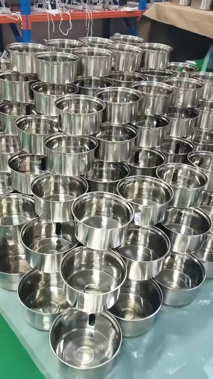 Round stainless steel housings arranged in rows at the factory