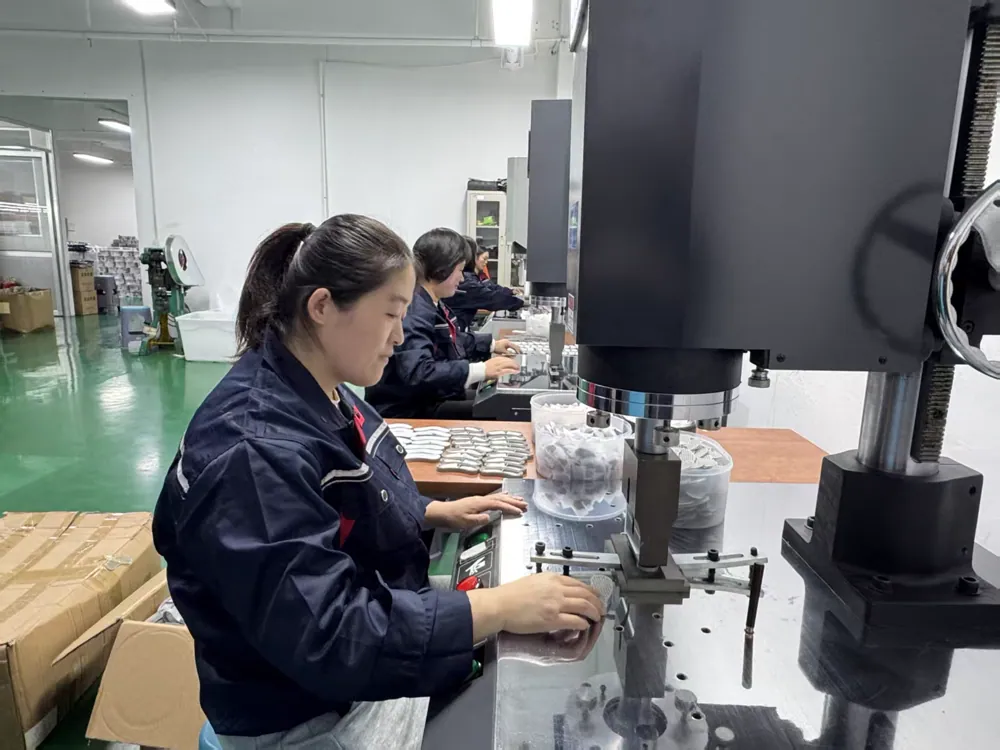 Workers operating equipment in the Fountelio workshop