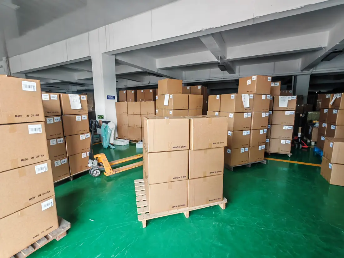 Palletized cartons arranged across the warehouse floor before shipment