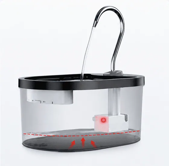 Red indicator showing a low-water reminder on a plastic pet water fountain