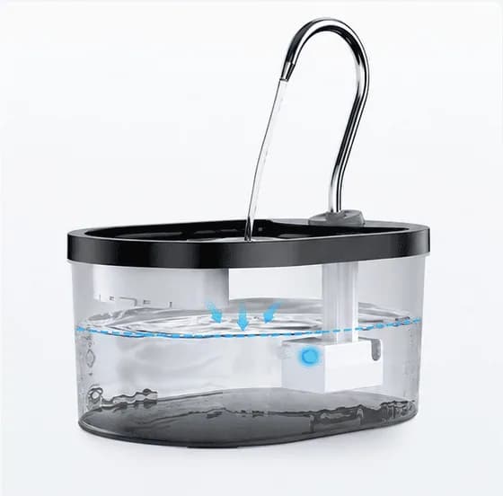 Blue indicator showing normal operation on a plastic pet water fountain