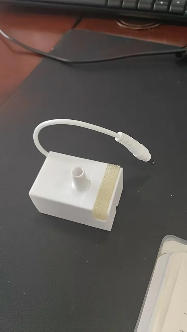 Fountelio pump module with a short cable and connector visible beside the pump body