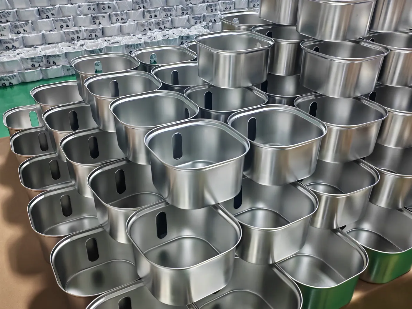Stainless steel fountain housings staged before assembly and packing