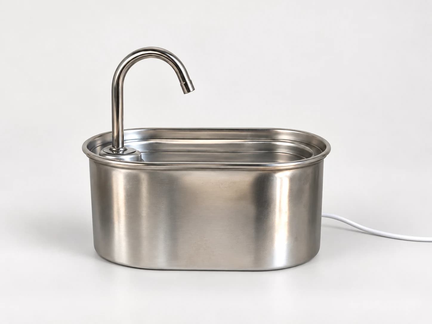 Edited product illustration showing an oval steel reservoir, curved metal spout and white power cable