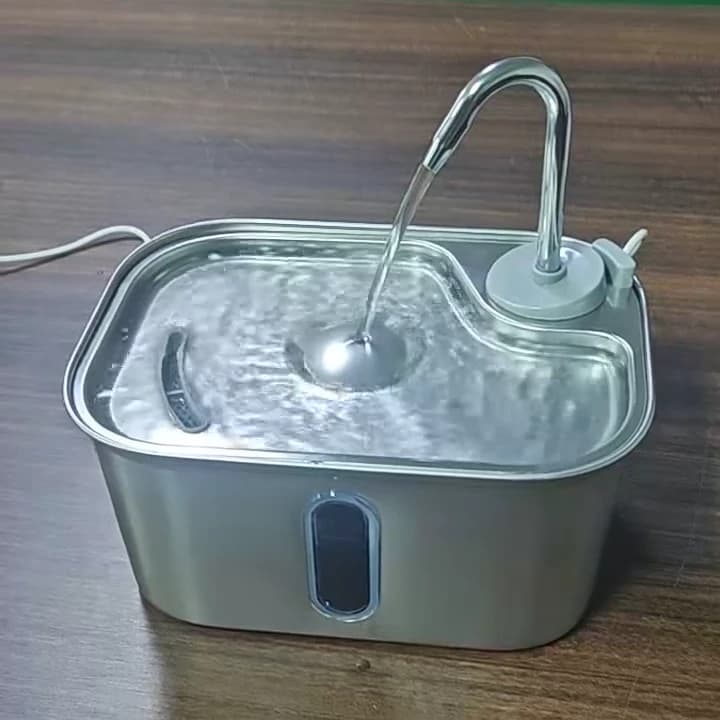 Complete rectangular stainless steel cat water fountain with curved metal spout, flowing water and front viewing window